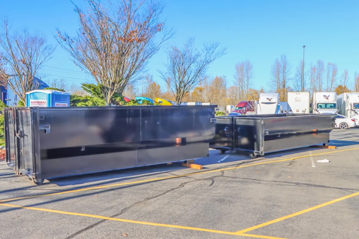 Professional dumpster rental service with roll-off container on residential driveway in Steubenville